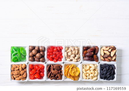 Mix of dried and candied fruits and nuts Mix of dried and candied fruits and nuts 117169559