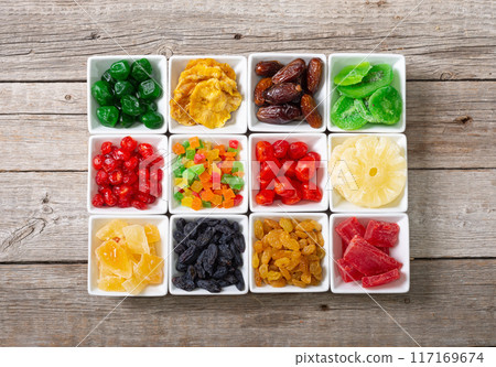 Group of dried and candied fruit in bowl 117169674