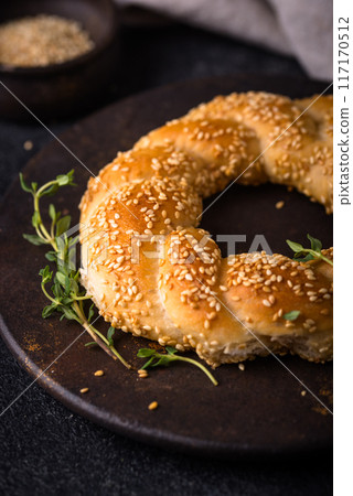 Traditional Turkish bagel simit with sesame Traditional Turkish bagel simit with sesame 117170512