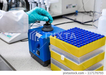 Before HPLC analysis, a chemist agitates the samples using a vortex mixer 117170793