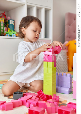 cute baby girl playing with colorful toys bricks at home cute baby girl playing with colorful toys bricks at home 117170828