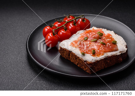 Sandwich or bruschetta with toast, salmon, cream cheese 117171760
