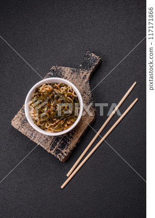 Asian dish rice noodles with salt and spices 117171866