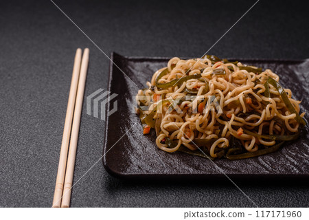 Asian dish rice noodles with salt and spices 117171960