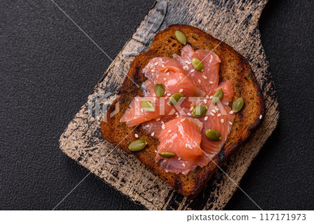 Sandwich or bruschetta with toast, salmon, cream cheese 117171973