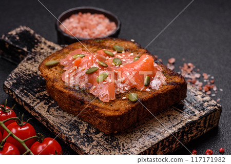 Sandwich or bruschetta with toast, salmon, cream cheese Sandwich or bruschetta with toast, salmon, cream cheese 117171982