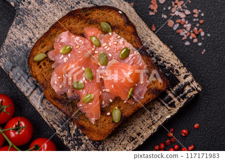 Sandwich or bruschetta with toast, salmon, cream cheese 117171983