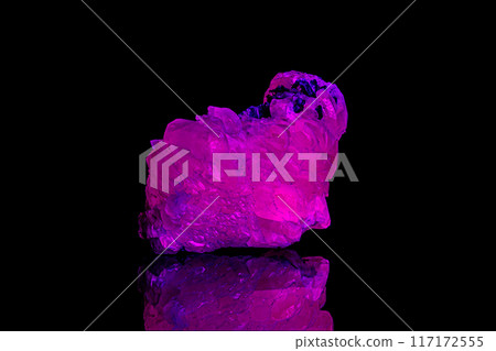 macro mineral stone calcite under ultraviolet light on a black background macro mineral stone calcite under ultraviolet light on a black background 117172555