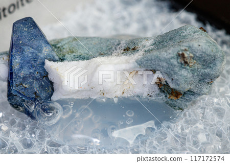 macro mineral stone Benitoite on a black background 117172574