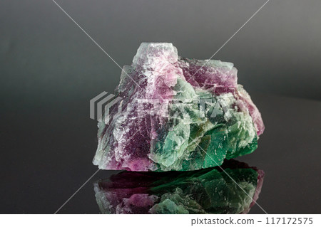 macro mineral stone red and green fluorite on a black background macro mineral stone red and green fluorite on a black background 117172575