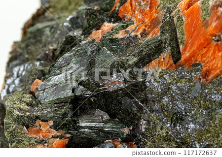 Macro stone mineral Diopside Calcite Magnetite on a white background 117172637