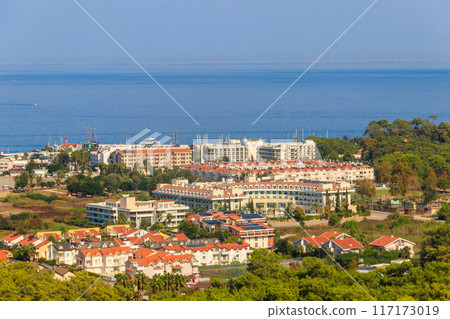 View of Kemer town on a coast of the Mediterranean sea in Antalya province, Turkey. Turkish Riviera. View from a mountain View of Kemer town on a coast of the Mediterranean sea in Antalya province, Turkey. Turkish Riviera. View from a mountain 117173019