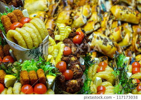 Appetizing colorful street fast food servings at a market stall, La Boqueria food market, Barcelona Appetizing colorful street fast food servings at a market stall, La Boqueria food market, Barcelona 117173038