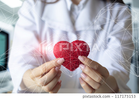 The doctor shows symbol of warmth and love for the patients. The doctor shows symbol of warmth and love for the patients. 117173153