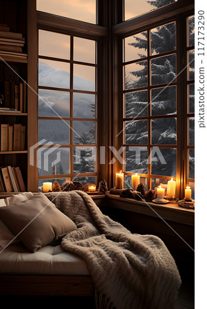 Cozy living room with sofa and panoramic window overlooking the winter mountains and forest 117173290