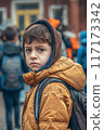 Boy in Yellow Jacket with Backpack 117173342
