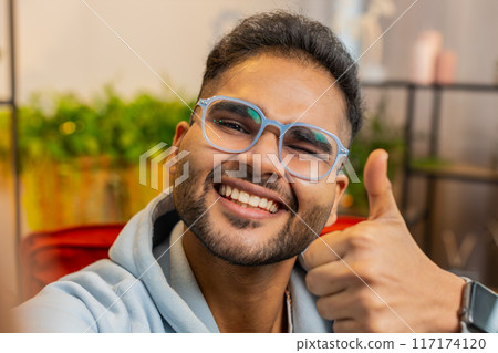 POV view man blogger taking selfie on smartphone video call online conversation recording stories POV view man blogger taking selfie on smartphone video call online conversation recording stories 117174120