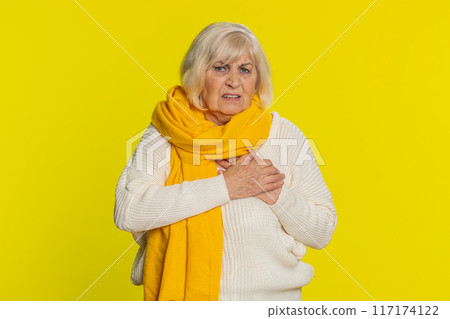 Stressed sick Senior woman suffers from tension holding chest with heart pain attack risk of stroke Stressed sick Senior woman suffers from tension holding chest with heart pain attack risk of stroke 117174122