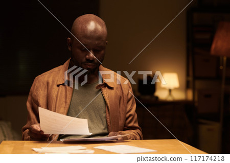Looking through unpaid financial bills Looking through unpaid financial bills 117174218