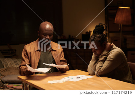 Unhappy couple with overdue bills 117174219