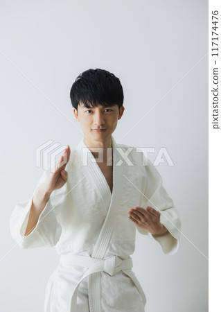 Man in judo uniform Man in judo uniform 117174476