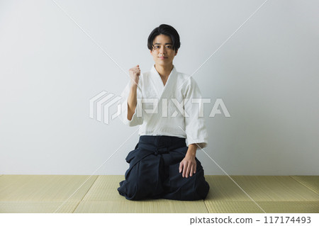 Man in judo uniform and hakama Man in judo uniform and hakama 117174493