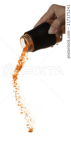 Chilli seasoning powder flavor falling from shaker bottle, red chilli and seasoning powder splash in mid air. Seasoning powder shaker spice up taste of food over white background isolated Chilli seasoning powder flavor falling from shaker bottle, red chilli and seasoning powder splash in mid air. Seasoning powder shaker spice up taste of food over white background isolated 117175241