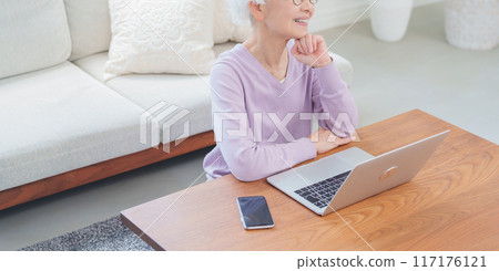 Elderly women using a personal computer Elderly women using a personal computer 117176121