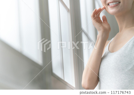 Middle-aged woman, hands, sunlight 117176743