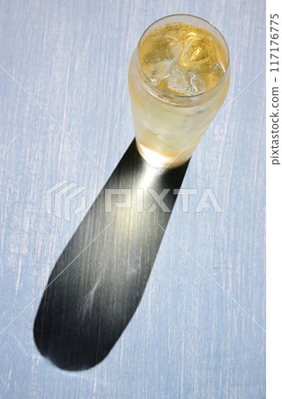 A highball with the light casting a shadow on the glass A highball with the light casting a shadow on the glass 117176775