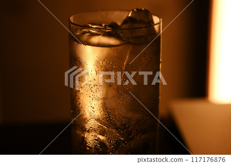 Image of drinking alone late at night 117176876