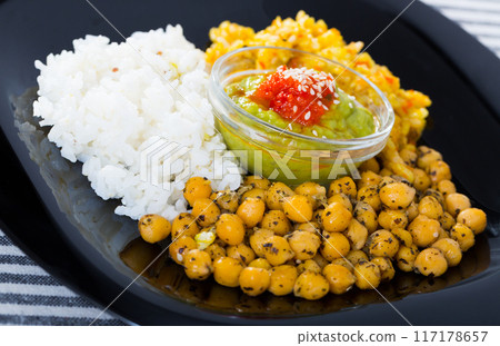 Healthy food of garbanzos and rice with red and green sauces Healthy food of garbanzos and rice with red and green sauces 117178657