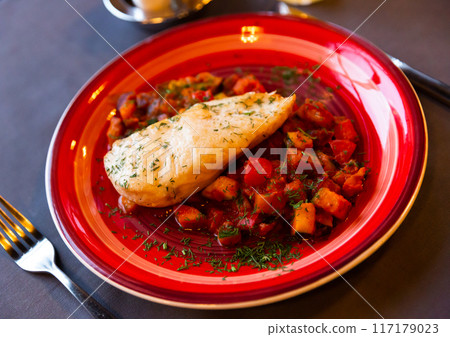 Chicken breast baked and served with stewed vegetables Chicken breast baked and served with stewed vegetables 117179023