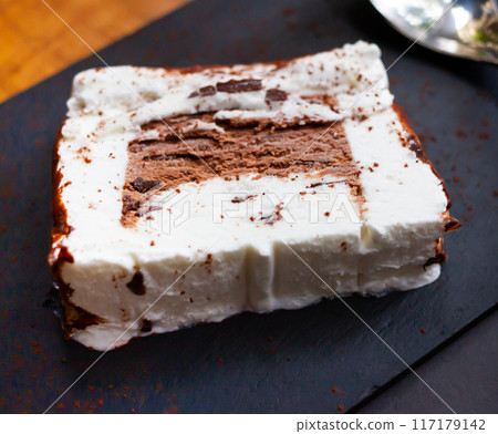 Slice of fresh Canada Tarta on plate 117179142