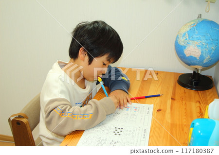 A boy studying A boy studying 117180387