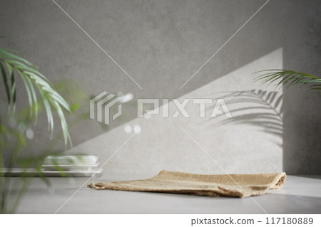 A gray-toned tile background with various props with sunlight coming through the window. A gray-toned tile background with various props with sunlight coming through the window. 117180889