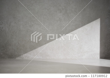 A gray-toned tile background with various props with sunlight coming through the window. A gray-toned tile background with various props with sunlight coming through the window. 117180912