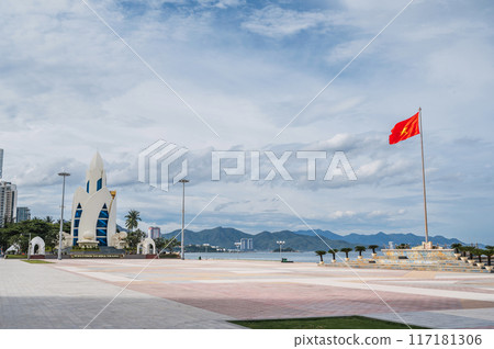central square in Nha Trang city with Lotus Tower and the flag of Vietnam on a cloudy morning in summer 117181306