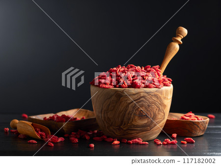 Dried goji berries on a black background. 117182002