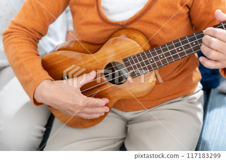 Ukulele in hand, senior woman 117183299