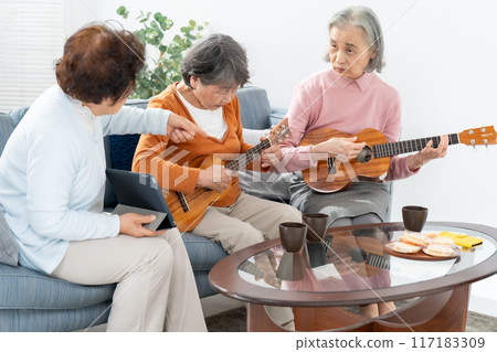 Senior woman hobby ukulele 117183309