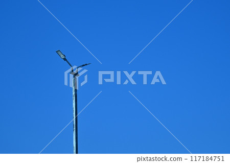 Light pole, clear blue sky background Light pole, clear blue sky background 117184751