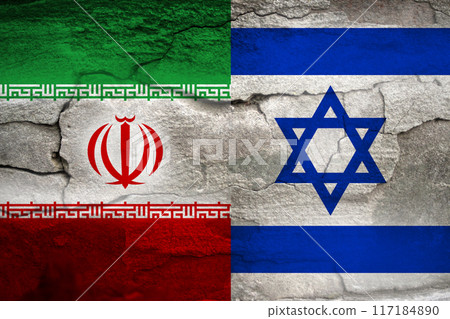 Iran Israel war. Flags of Israel and Iran displayed on a cracked concrete wall texture, creating a grunge background. This imagery symbolizes the concept of military conflict between the two nations Iran Israel war. Flags of Israel and Iran displayed on a cracked concrete wall texture, creating a grunge background. This imagery symbolizes the concept of military conflict between the two nations 117184890