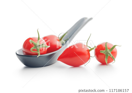 Red cherry tomatoes isolated on white background. Red cherry tomatoes isolated on white background. 117186157
