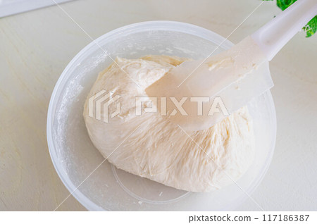 Dough gathered with a ciabatta spatula 117186387