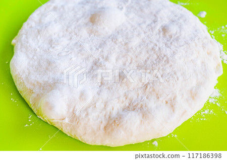 Dough stretched after first rise 117186398