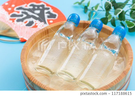 Ramune soda and festival fans cooled in a bucket of water and ice 117188615