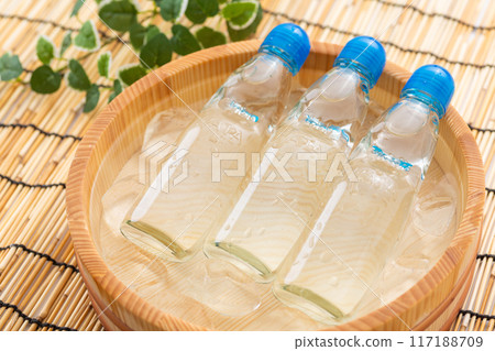 Ramune cooled in a bucket of water and ice 117188709