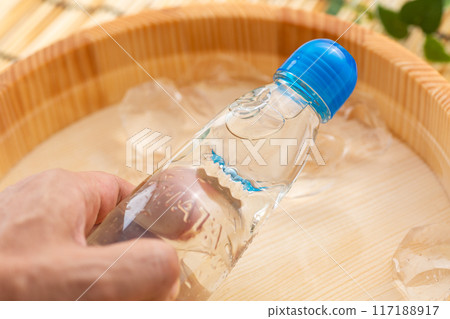 Ramune cooled in a bucket of water and ice 117188917