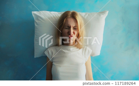 Upset crying woman closed her eyes lying on the pillow while experiencing insomnia suffering at home Upset crying woman closed her eyes lying on the pillow while experiencing insomnia suffering at home 117189264